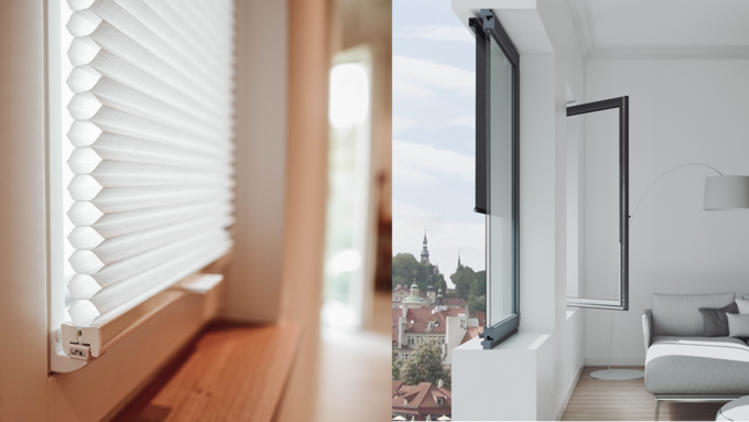 Links ein weisses Wabenplissee vor einem Fenster, rechts ein geöffnetes Fenster mit aussenliegendem Rollo in einem modernen Wohnzimmer mit Blick auf eine Stadt.